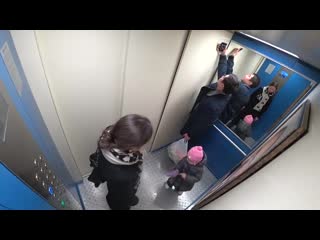prank. portrait of putin in the lift. residents of the entrance in shock.